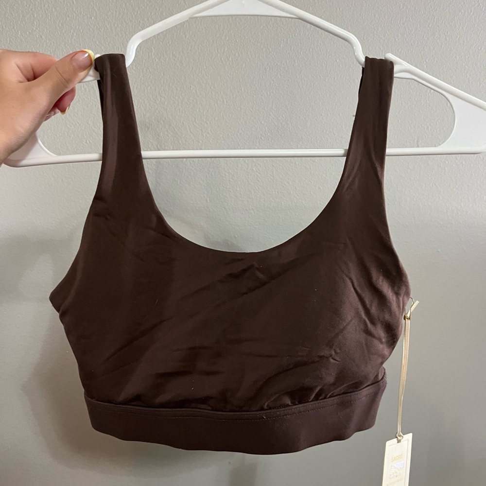 Built in padding, well supported sports bra. New condition with tags.